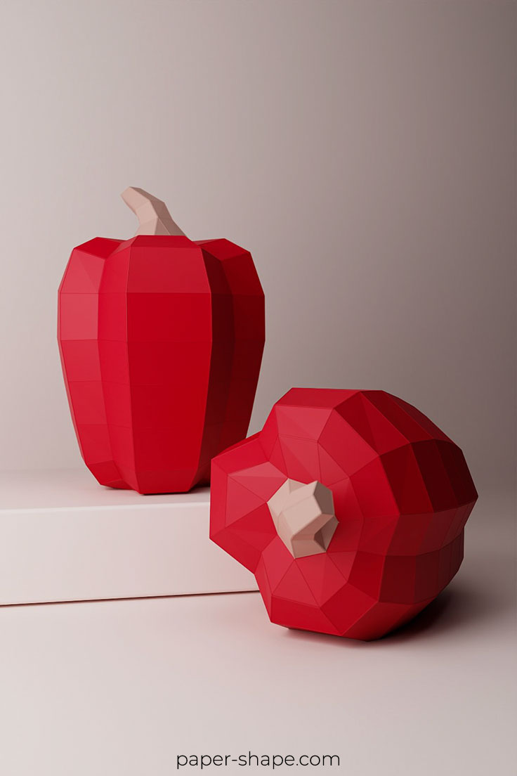 Zwei große rote Paprikas aus Papier in 3D. 