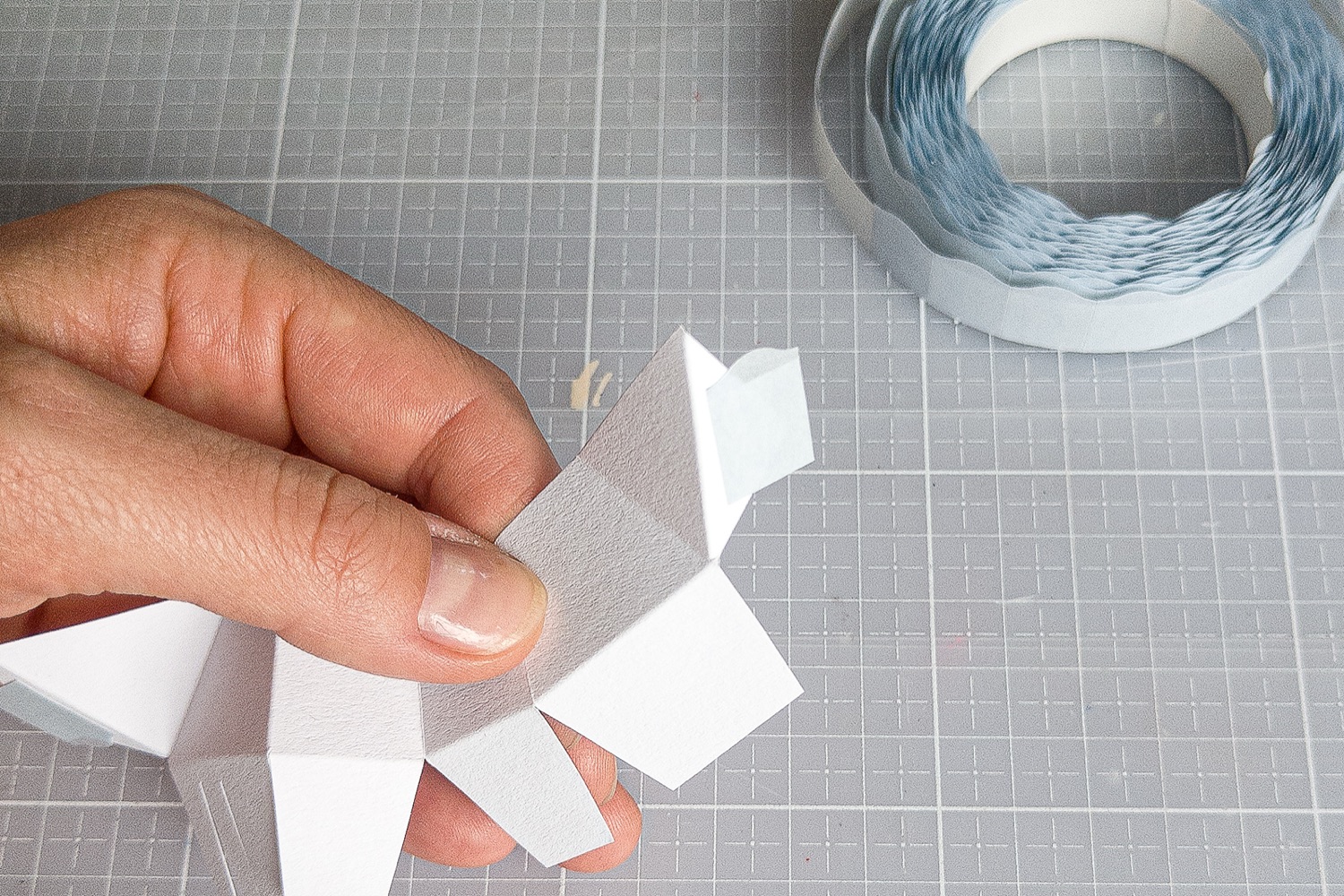 Applying an adhesive pad to a Westie papercraft tab