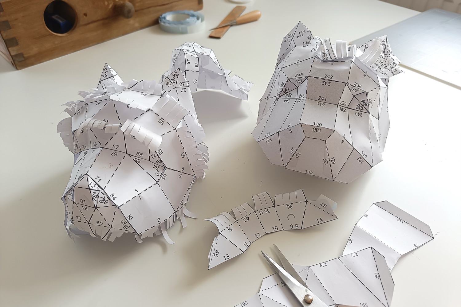 Paper prototype of the Westie with numbered tabs and fringes