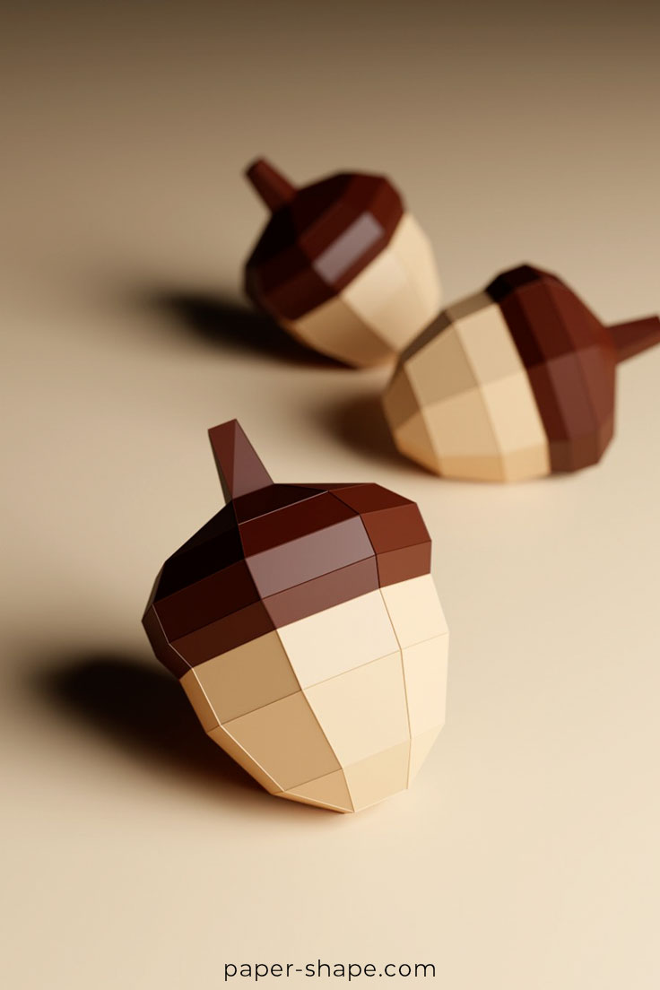 Three papercrafted acorns 