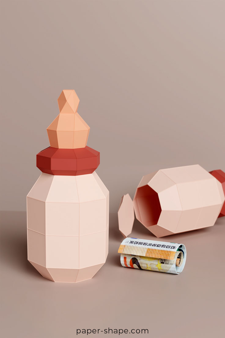 Babyflasche aus Papier mit offenem Deckel und einer Idee als Geldgeschenk