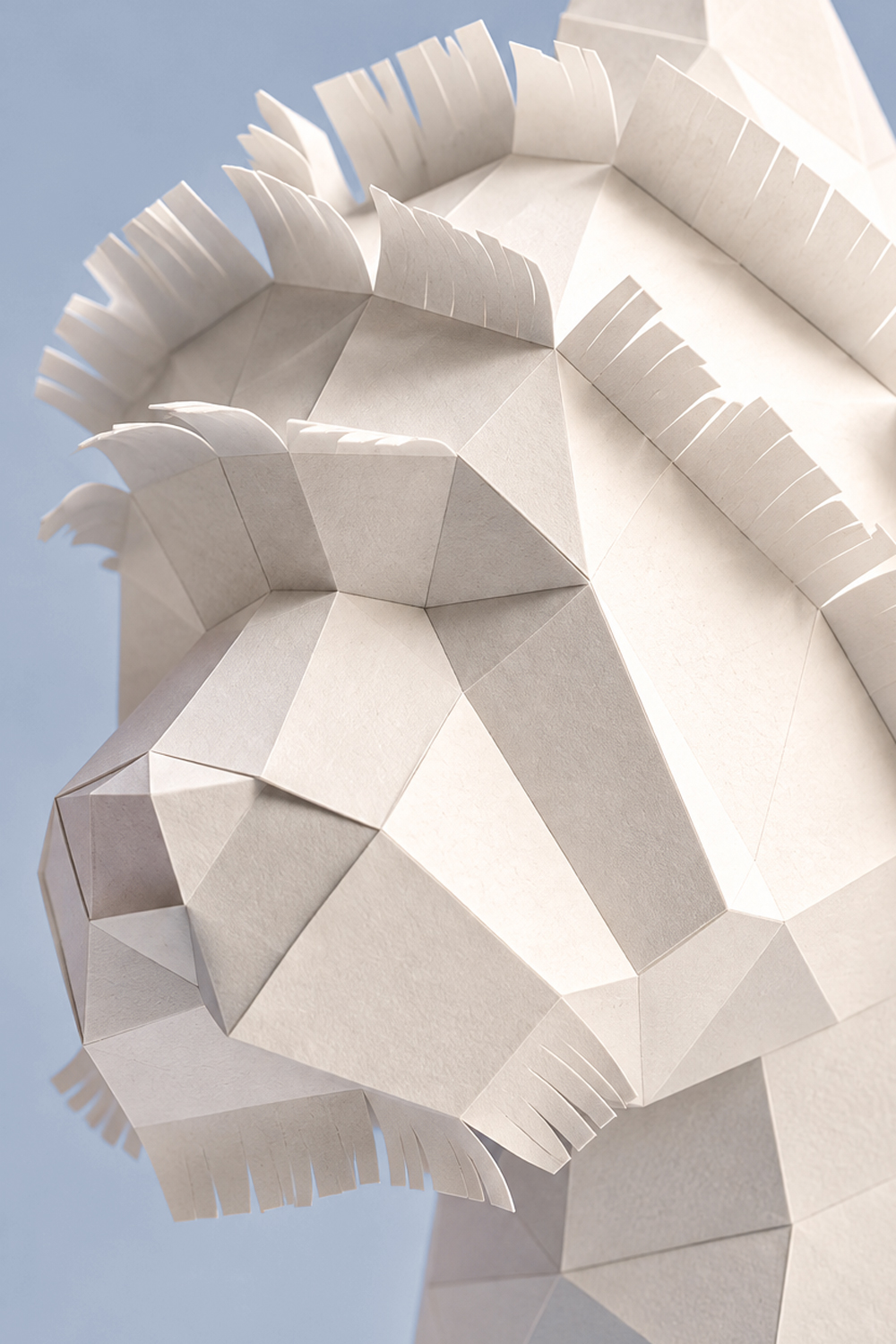 Macro shot of the papercraft Westie’s head with finely cut fringes forming the shaggy coat.